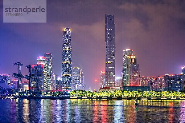 Guangzhou cityscape skyline over the Pearl River illuminated in the evening. Guangzhou  China  Asien