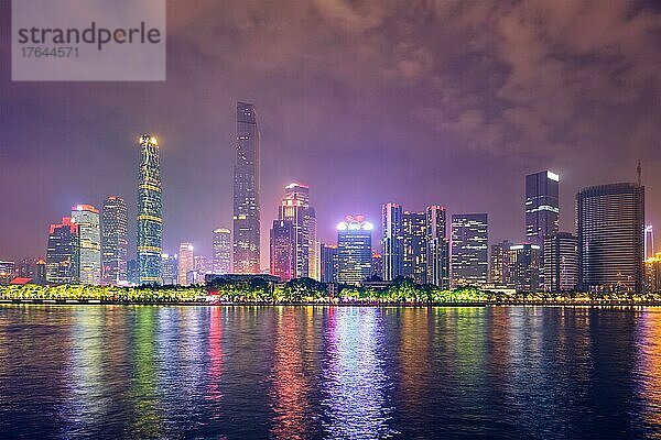 Guangzhou cityscape skyline over the Pearl River illuminated in the evening. Guangzhou  China  Asien
