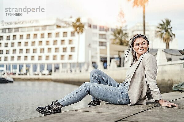 A portrait of a young woman enjoying time outdoor in marina