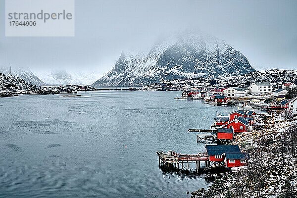 Reine fishing village on Lofoten islands with red rorbu houses in winter with snow. Lofoten islands  Norway