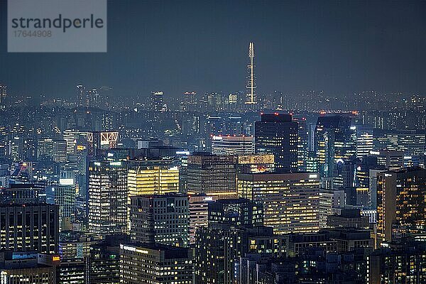 Seoul downtown cityscape illuminated with lights and Namsan Seoul Tower in the evening view from Inwang mountain. Seoul  South Korea