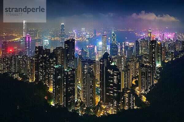Famous view of Hong Kong  Hong Kong skyscrapers skyline cityscape view from Victoria Peak illuminated in the evening blue hour. Hong Kong  China  Asien