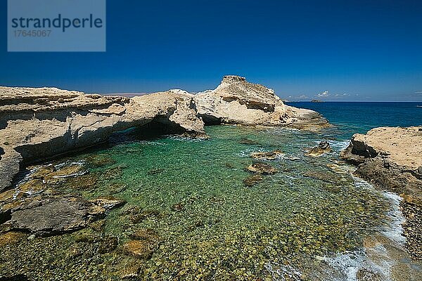 The beach of Agios Konstantinos with crystal clear turquoise water and rock formations in Milos island  Greece