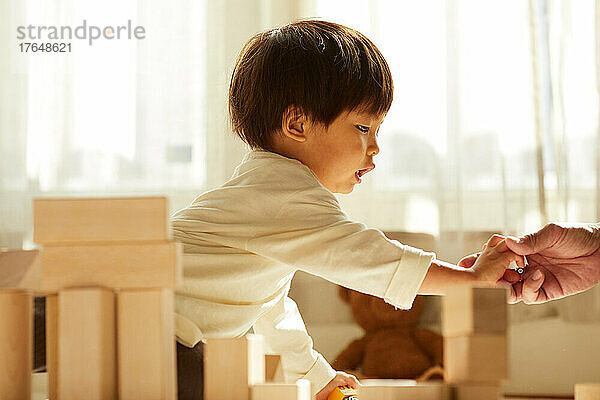 Japanese kid playing at home