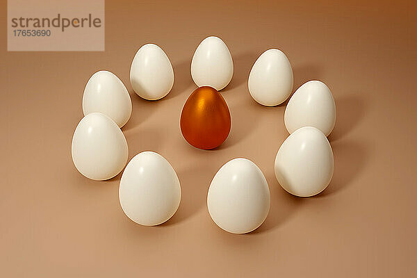Dreidimensionale Darstellung eines orangefarbenen metallischen Eies  umgeben von weißen Eiern