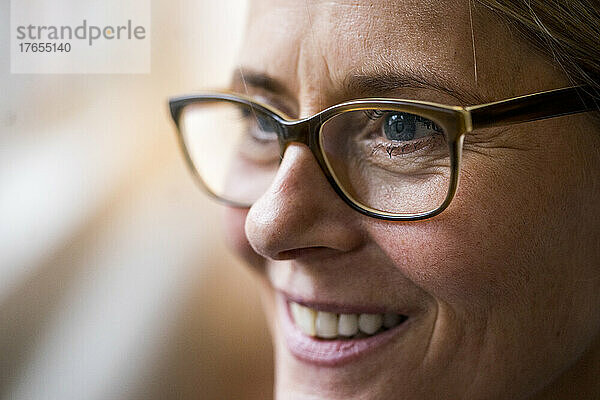 Smiling mature woman wearing eyeglasses