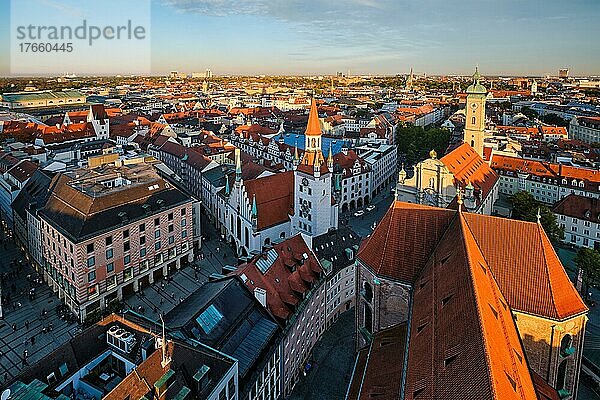 Aerial view of Munich  Marienplatz and Altes Rathaus from St. Peter's church on sunset. Munich  Germany