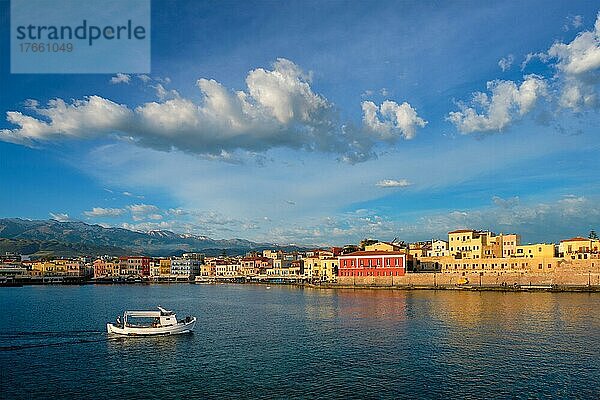 Fishing boat going to sea in picturesque old port of Chania is one of landmarks and tourist destinations of Crete island in the morning. Chania  Crete  Greece