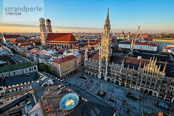 Aerial view of Munich  Marienplatz  Neues Rathaus and Frauenkirche from St. Peter's church on sunset. Munich  Germany