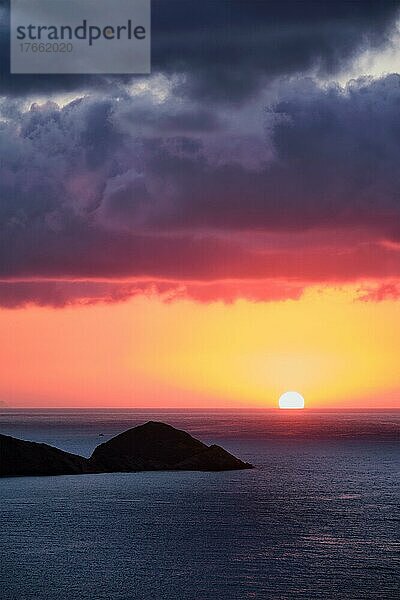 Sea sunset. Seascape sunset with island. Sun setting down in sea. Crete island  Greece