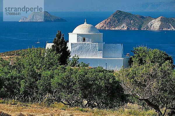 Scenic view of Milos island  Aegean sea and Greek Orthodox traditional whitewashed church. Milos island  Greece