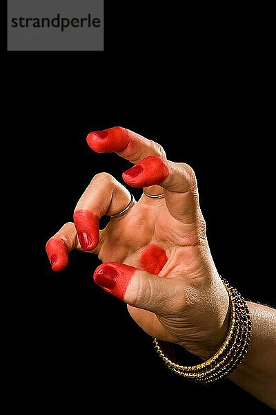 Woman hand showing Kangula hasta (meaning Tail) of indian classic dance Bharata Natyam