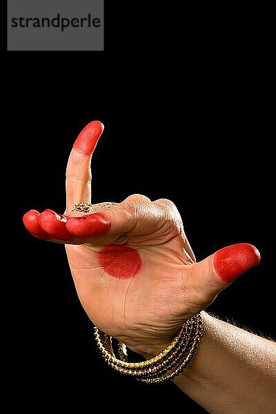 Woman hand showing Mrigasirsha hasta (meaning Deer head) of indian classic dance Bharata Natyam