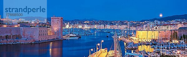 Panorama of Marseille Old Port and Fort Saint-Jean illumintaed in night with moon  Marseille  France  Horizontal camera pan