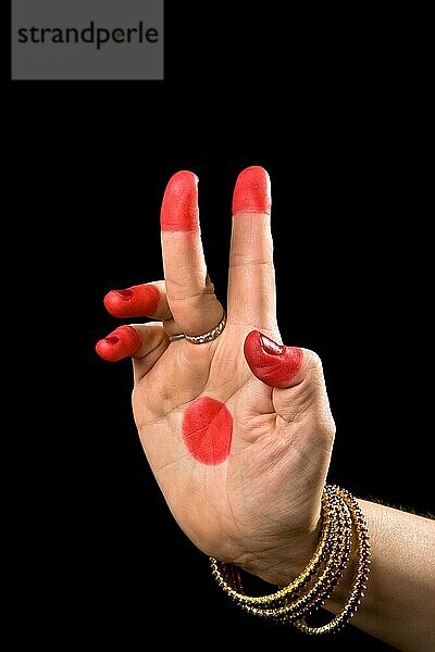 Woman hand showing Kartarimukha hasta (meaning scissors) of indian classic dance Bharata Natyam