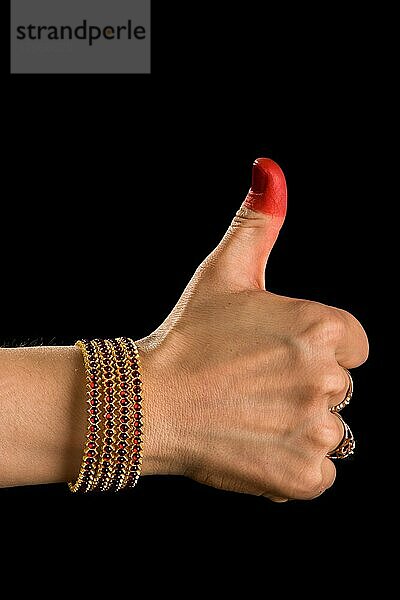 Woman hand showing Shikhara hasta (hand gesture) (also called mudra) (meaning fist) of indian classic dance Bharata Natyam. Also used in Indian dances Odissi and Kuchipudi