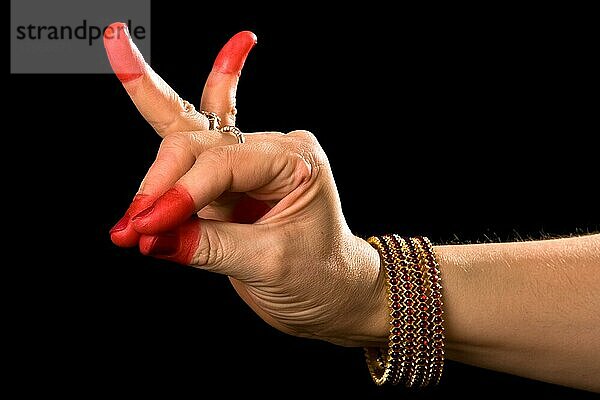 Woman hand showing Katakamukha hasta (meaning Opening in a Bracelet) of indian classic dance Bharata Natyam