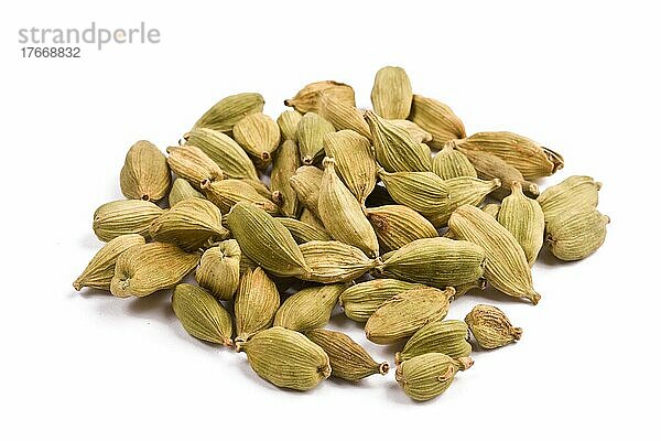 Pile of cardamom before white background close up