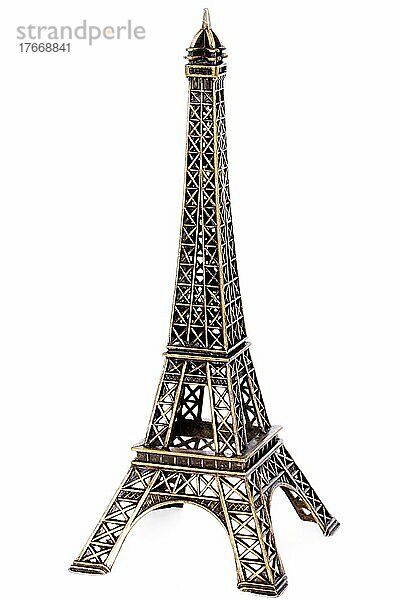 Small bronze copy of Eiffel tower figurine before white background