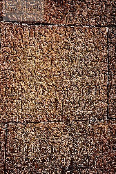 Ancient inscriptions on stone wall in Tamil language India