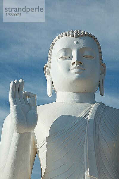 White sitting Budha image close up Mihintale  Sri Lanka  Asien
