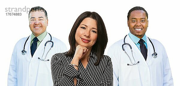 Two mixed-race doctors behind hispanic woman before a white background
