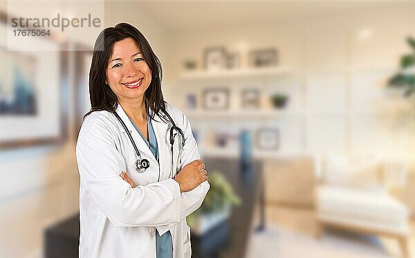 Female hispanic doctor or nurse standing in her office