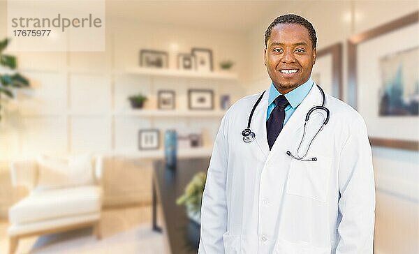 Young african american doctor or nurse standing in his office
