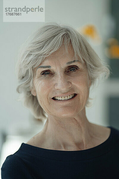 Happy senior woman with gray hair