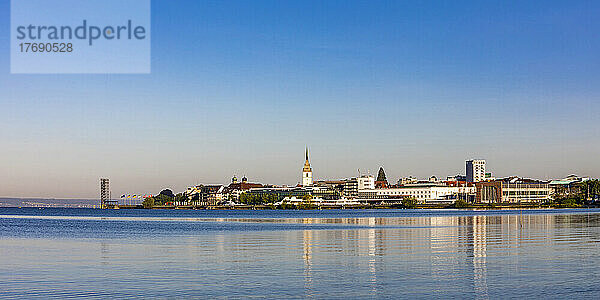 Germany  Baden-Wurttemberg  Friedrichshafen  Panoramic view of town on shore of Lake Constance at dusk