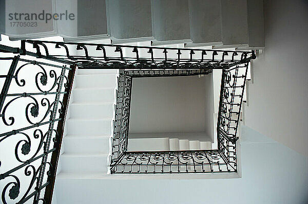 High Angle View Of A Staircase With An Ornate Black Railing; Mailand  Italien