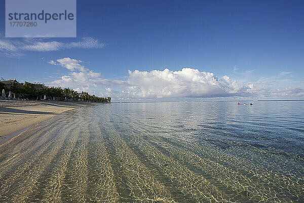 Ripples In The Sand Under The Clear Water On The Coast Of An Island In The Indian Ocean; Mauritius