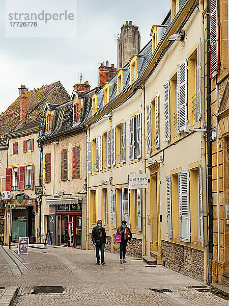Walkers on a small-town street in southern Burgundy  Burgundy  France  Europe
