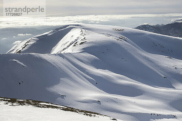 Gentle mountains fully covered by snow in the Corno alle Scale regional park  Emilia Romagna  Italy  Europe