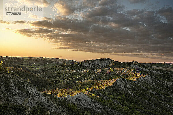 Sunset above badlands and countryside with colored clouds in the sky  Bologna  Emilia Romagna  Italy  Europe