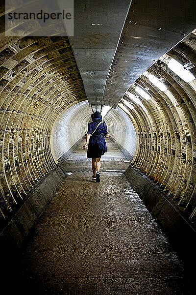 Woman walking through the Greenwich foot tunnel  Greenwich  London  England  United Kingdom  Europe