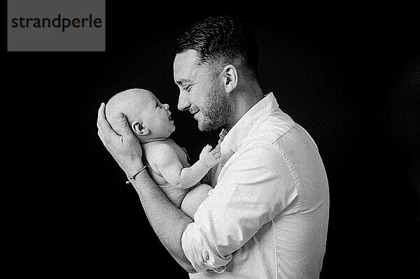 Father with a baby  studio shot  United Kingdom  Europe