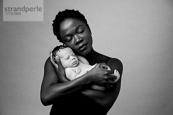 Mother with a baby  studio shot  United Kingdom  Europe