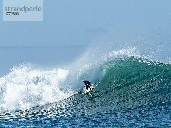 Surfer at North Reef  Lighthouse Bay  Exmouth  Western Australia  Australia  Pacific