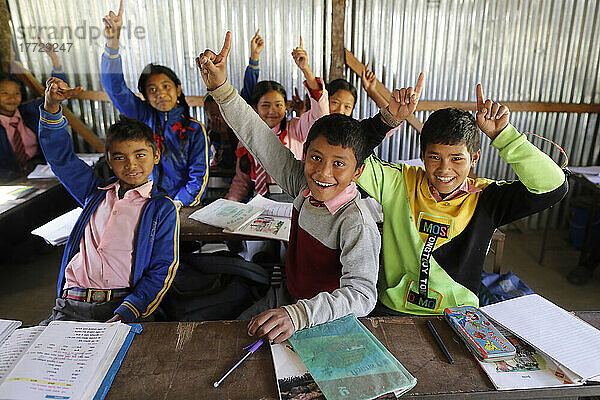 Primary school classroom with smiling children  Lapilang  Dolakha  Nepal  Asia
