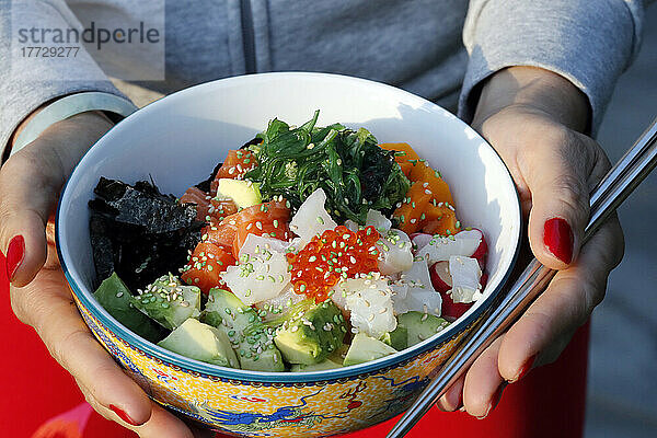 Asian cuisine  fish poke bowl with seaweed  avocado  cucumber  radish  sesame seeds  Haute-Savoie  France  Europe