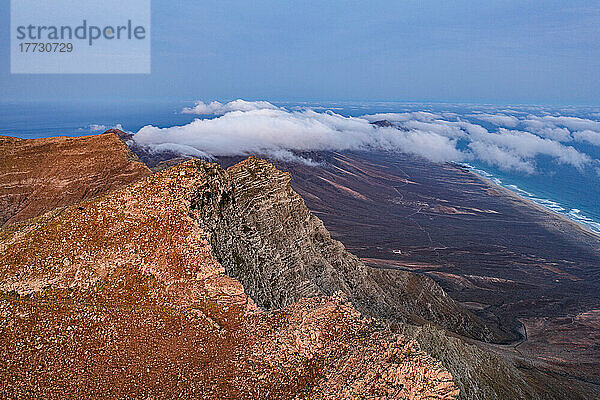 Aerial view of volcanic rocks of Pico de la Zarza mountain peak during a misty sunrise  Fuerteventura  Canary Islands  Spain  Atlantic  Europe