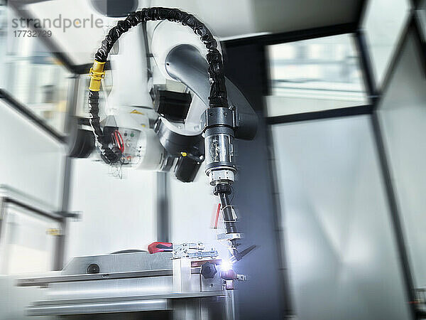 Blurred motion of robotic arm in industry