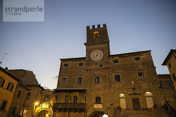 Italy  Province of Arezzo  Cortona  Facade of medieval town hall at dusk