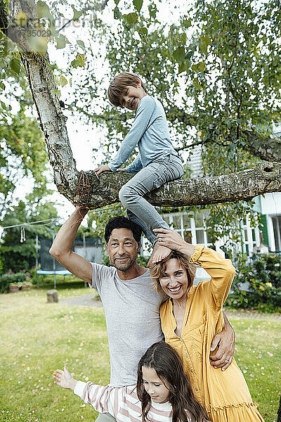 Happy family enjoying together in back yard