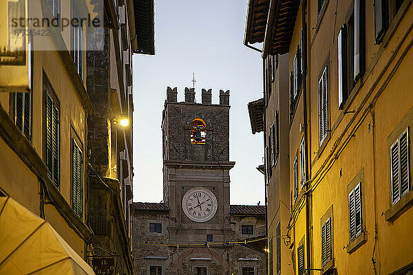 Italy  Province of Arezzo  Cortona  Tower of medieval town hall with houses in foreground