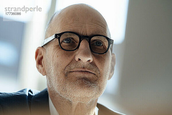 Senior businessman wearing eyeglasses in office