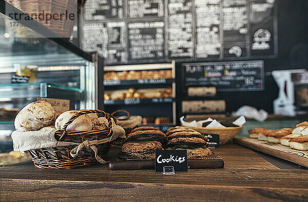Fresh assortment of cookies and breads on table in bakery