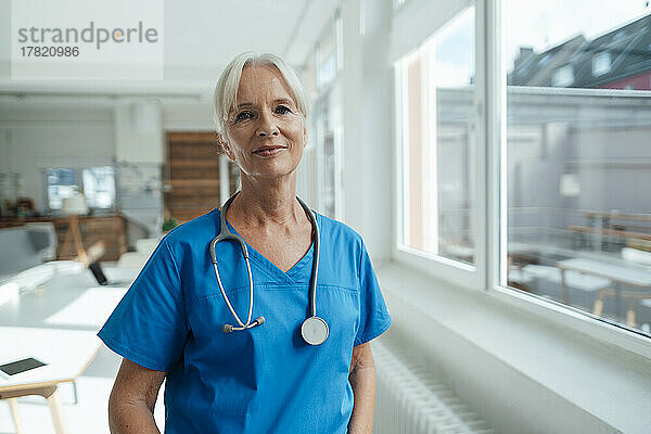 Female senior doctor with stethoscope