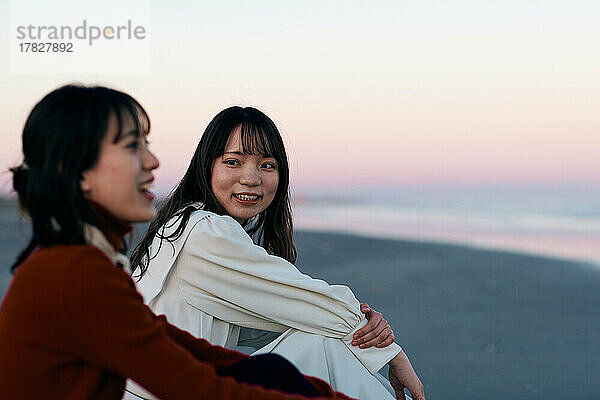 Young Japanese women enjoying themselves at the beach
